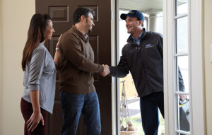 air conditioning installer greeting homeowners