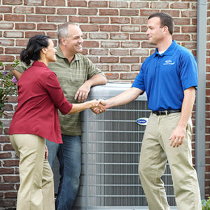 Carrier Air Conditioning Installer With Couple at West Windsor NJ Home