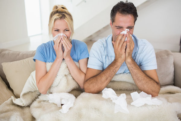 image of a couple suffering from poor indoor air quality