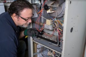 a furnace being installaed by an HVAC contractor