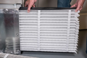 image of an oil-fired furnace filter replacement