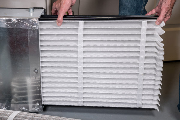 image of an oil-fired furnace filter replacement