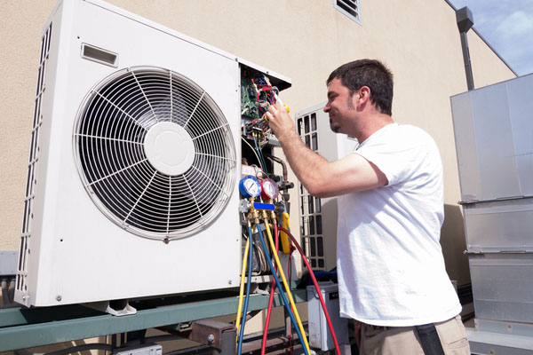 HVAC contractor connecting wiring on ductless mini-split system