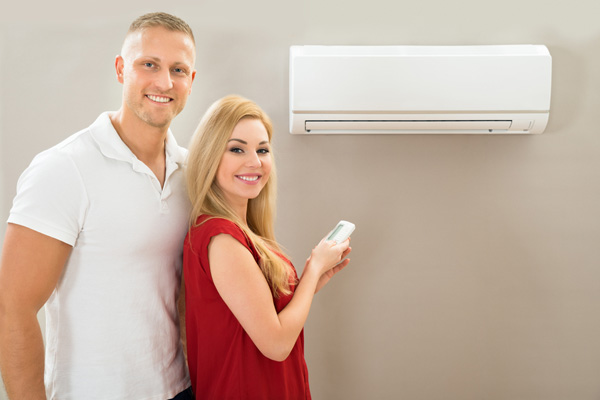 image of a couple with a ductless heat pump