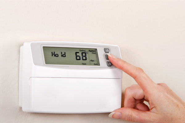 hand increasing heating temperature at home