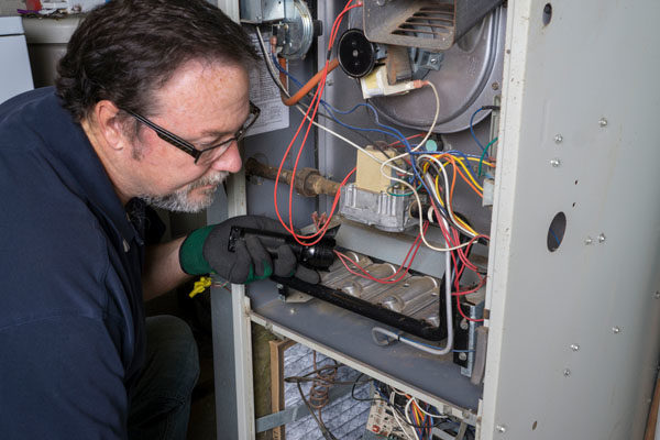 image of an hvac contractor performing a furnace installation