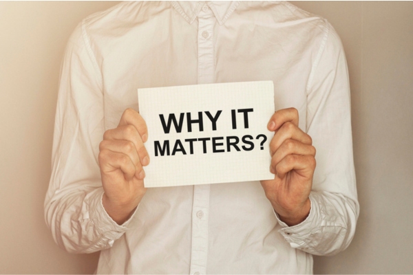 cropped view of a man holding a sign that says why it matters depicting indoor air quality
