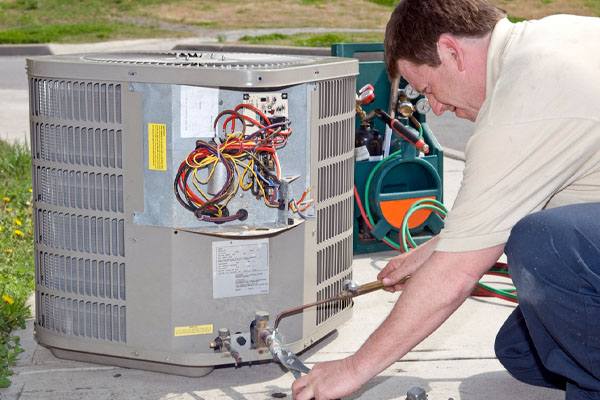 hvac contractor performing air conditioner tune-up