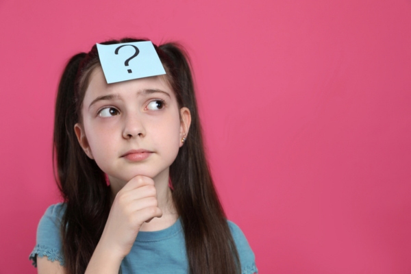 young girl with a sticky note with question mark on her forehead depicting Annual Air Conditioner Tune-Up