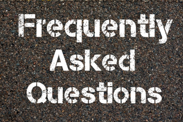 Frequently Asked Questions spray painted on concrete depicting FAQs about heat pump leaking water