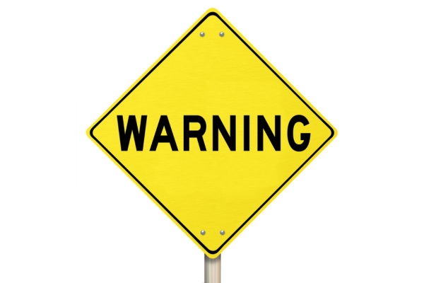 yellow warning sign depicting AC refrigerant leak