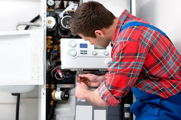 hvac technician is checking heating system during hvac installation