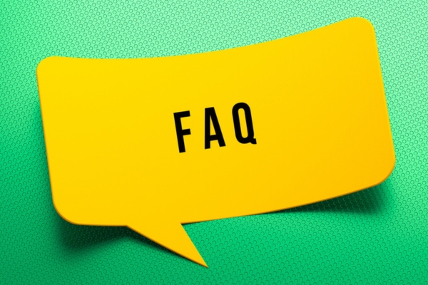 FAQ written on message bubble cutout depicting common questions about HVAC installation