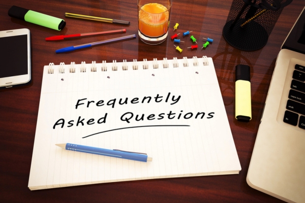 Frequently Asked Questions written on a notebook depicting questions about Standby Generator Maintenance