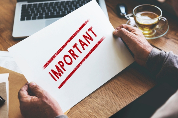 Person holding paper with red stamp that says important depicting Routine Generator Upkeep