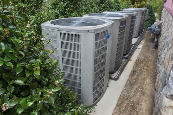 image of outdoor ac units that do not have enough clearance around them