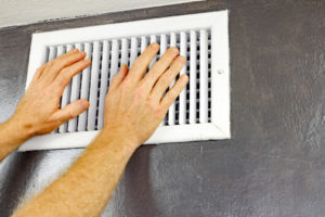 air conditioning vent with ac unit that is blowing smoke