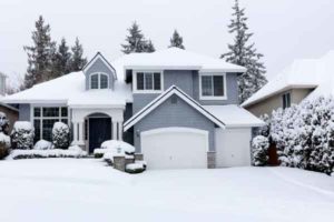 image of a house in winter that uses heating oil