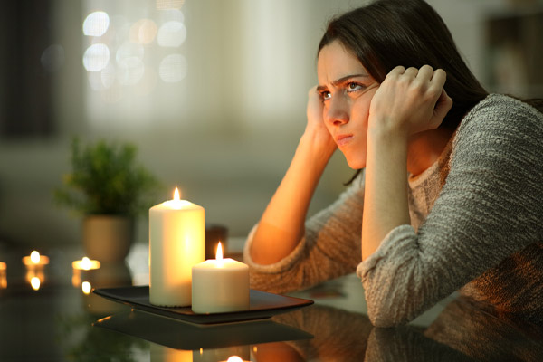 image of a homeowner during power outage because standby generator failed to start