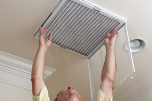image of an hvac air filter replacement by hvac contractor