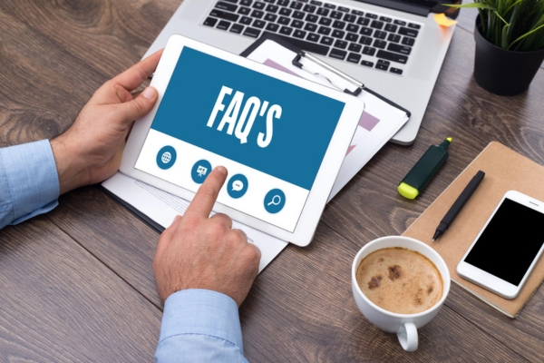 FAQS displayed on a smart tablet depicting questions about Outside AC Unit Tripping Breaker
