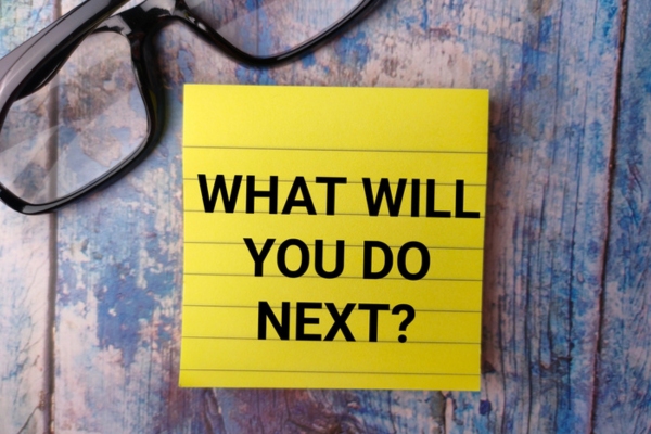 Glasses and sticky note with the word WHAT WILL YOU DO NEXT depicting outside ac unit tripping breaker