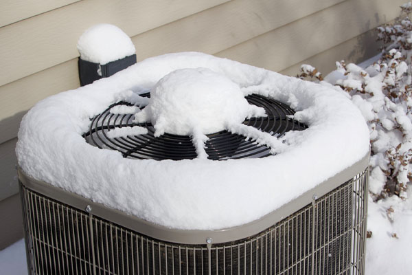 frozen heat pump in winter