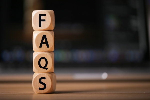 FAQS spelled using wooden letter dice depicting questions about Ductless HVAC vs. Window Cooling Systems
