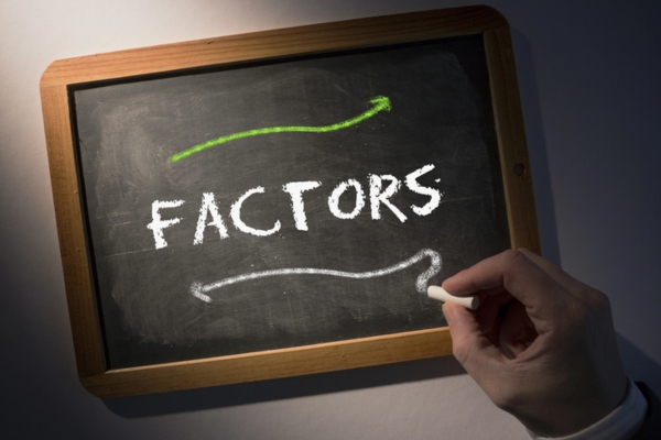 Factors written on a chalkboard depicting efficiency in heating oil