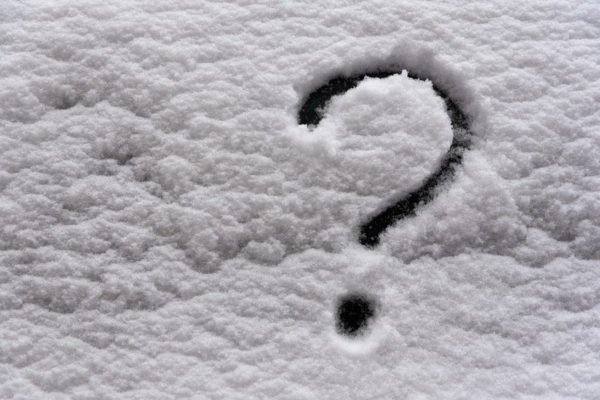 Question mark on drawn on snow depicting FAQs about heating oil technology