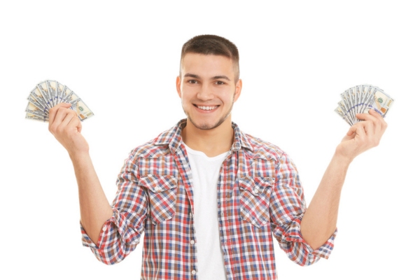 man holding dollar bills on both hands depicting heating oil Affordability and Efficiency