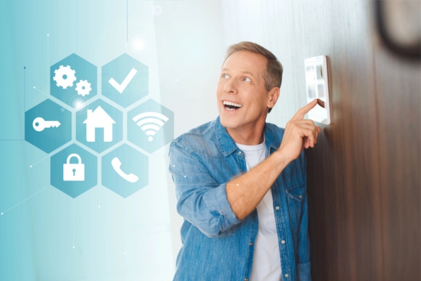 man looking up while pressing smart home control