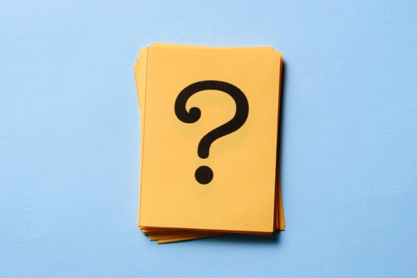 question mark on a stack of yellow paper depicting FAQs about Home Heating