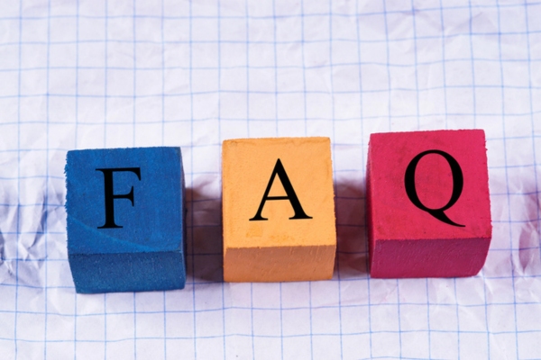 FAQ spelled using colorful wooden letter cubes depicting Furnace vs Heat Pump questions