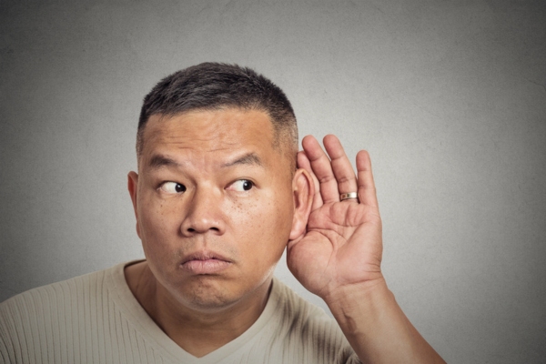man cupping ear while listening depicting Evaluating Furnace sound Concerns