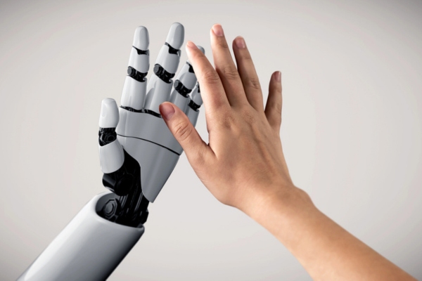 robot hand and human hand doing a high five depicting Future of Heating Efficiency Standards