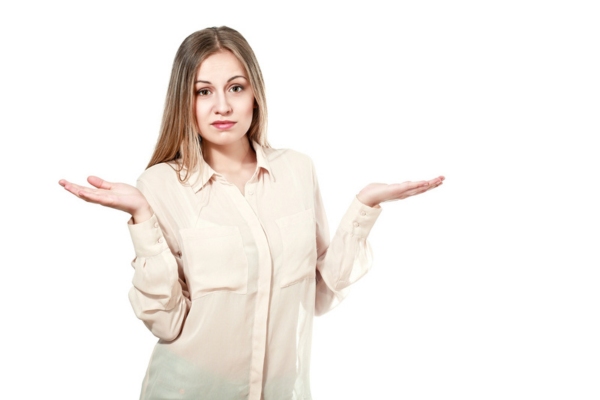 woman shrugging with hands on the side depicting Why Heating Efficiency Standards Are Important