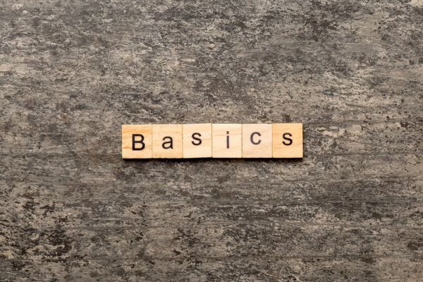 BASICS word spelled using wooden letter chips