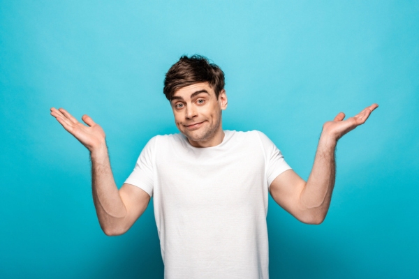 man shrugging with hands raised on the side depicting How Often Should You Replace Your HVAC Air Filter