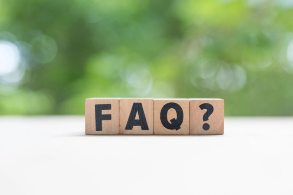FAQ spelled using wooden letter cubes depicting Air Conditioner Care questions