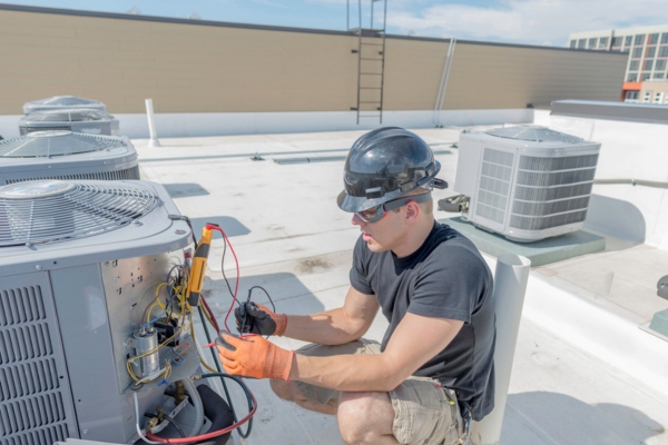 HVAC tech performing AC inspection