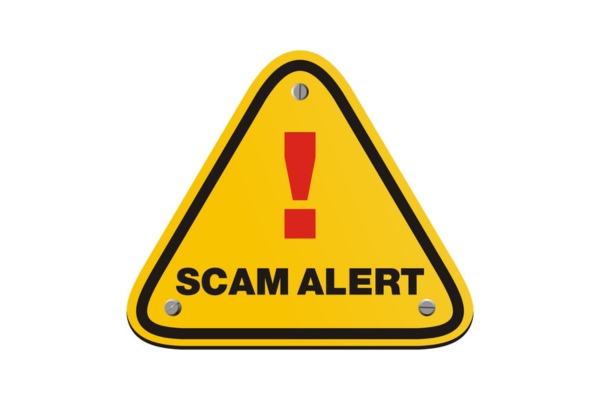 SCAM ALERT road sign depicting AC scams