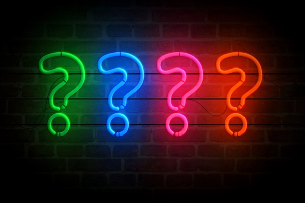 neon lights formed as question marks depicting Oil Heating System Maintenance