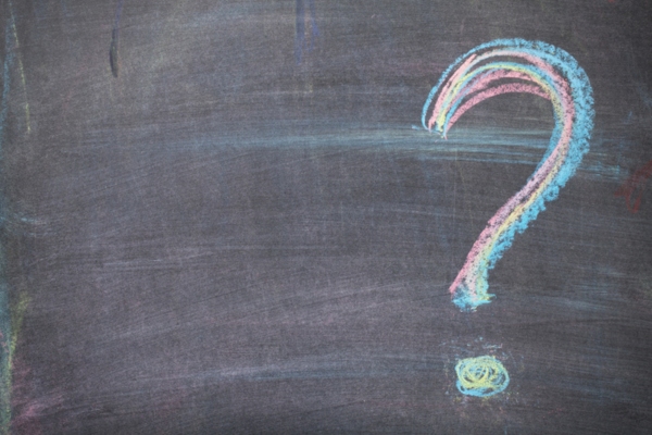 question mark written on a chalkboard depicting Air Conditioning in Public Spaces FAQs